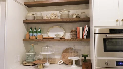 Kitchen shelf with different kind of dishware Stock Footage 148037023