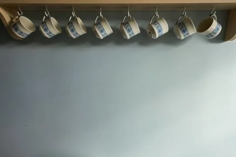 Kitchen shelf with hanging cups, blue floral pattern, home decor, light blu.. Stock Photos