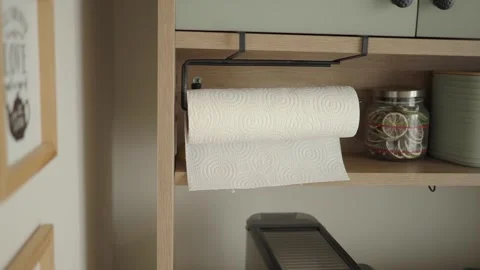 Kitchen shelf with paper towel holder and jars Stock Footage 343358944