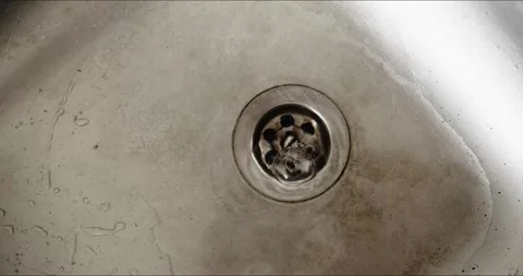 Kitchen sink drain needs cleaning to prevent debris buildup and maintain hygiene 動画素材 278027595