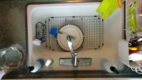 Kitchen Sink Washing Dishes Silverware Pots and Pans Stock Footage 321035580