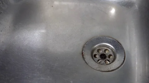 Kitchen sink with water drop dripping, background loop Stock Footage