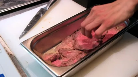 Kitchen. Slicing meat for barbecue. Beef for sandwiches Stock Footage 171592428