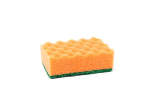 A kitchen sponge isolated against white background. Stock Photos