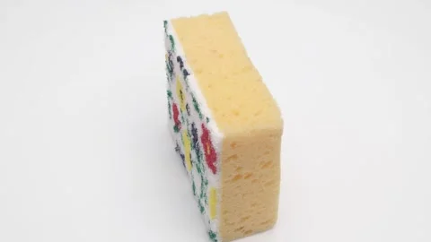 Kitchen sponge rotates on a white background. Stock Footage 270056104