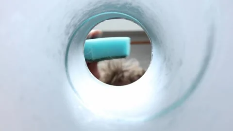 Kitchen sponge scrubs dish from unique inside perspective Vídeo Stock 337160751