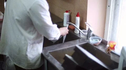 The kitchen staff washes the dishes Stock Footage 59697964