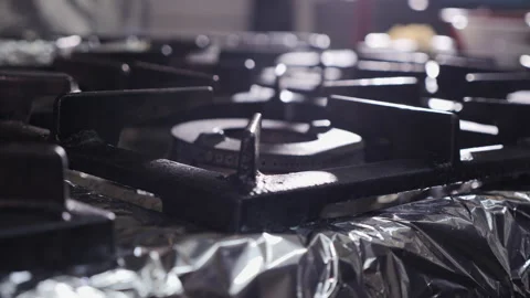 Kitchen stove burner turning on  - camera orbit, close up 스톡 동영상 152770186