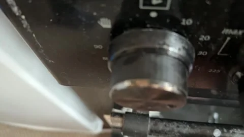 Kitchen stove knobs close up at home with hand adjusting control, changing heat 库存影片 337104766