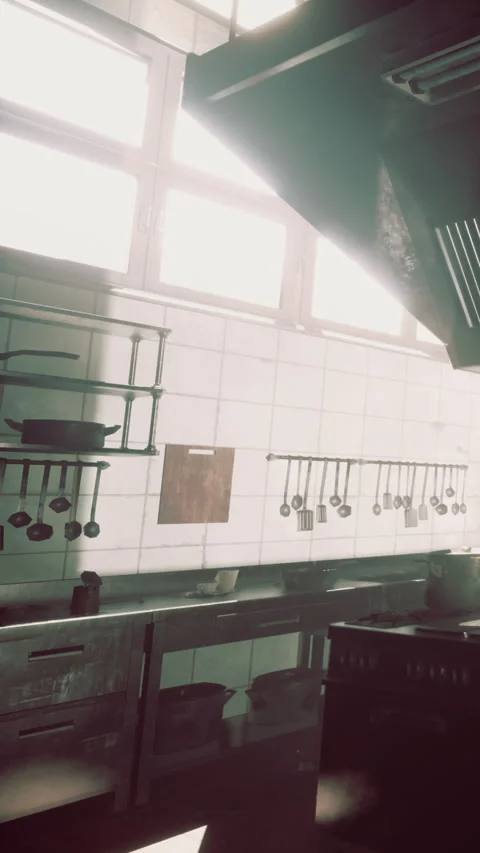 A kitchen with sunlight streaming through large windows Stock Footage 337941332