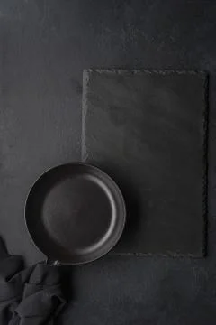 The kitchen surface and a black rag with a frying pan Stock Photos
