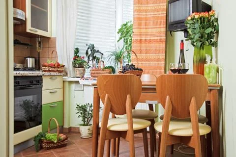Kitchen table and chairs with fruit basket Stock Photos