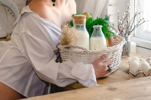 Kitchen table with bottled milk and herbs Stock Photos