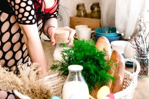 Kitchen table with bottled milk and herbs Stock Photos