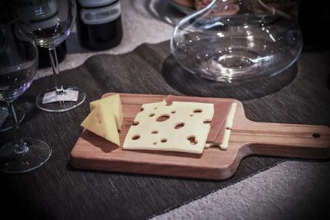 A kitchen table with cheese board Stock Photos