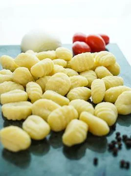Kitchen table with fresh gnocchi ready to boil Stock Photos