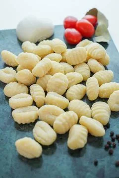 Kitchen table with fresh gnocchi ready to boil Stock Photos