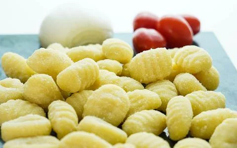 Kitchen table with fresh gnocchi ready to boil Stock Photos
