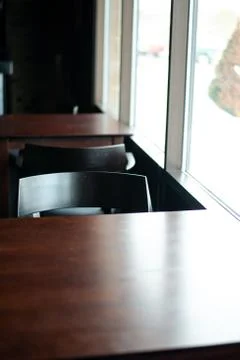 A kitchen with a table in front of a window Stock Photos