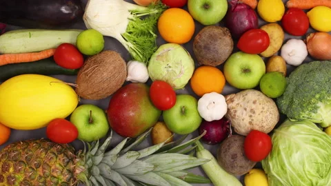 Kitchen table full with moving fresh healthy fruits and vegetables. Stop motion Stock-Footage 154521421