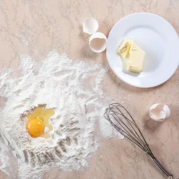 Kitchen table with ingredients for cooking baking. Copy space. Cooking concep Stock Photos