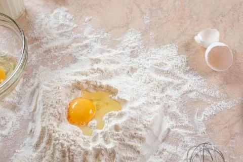 Kitchen table with ingredients for cooking baking. Copy space. Cooking concep Stock Photos