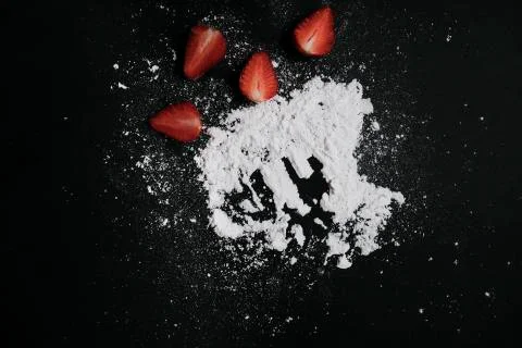Kitchen table with products, top view. Strawberry and flour. Top view in frame Stock Photos