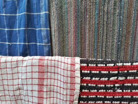 Kitchen table rags in different colors are hung outside Stock Photos