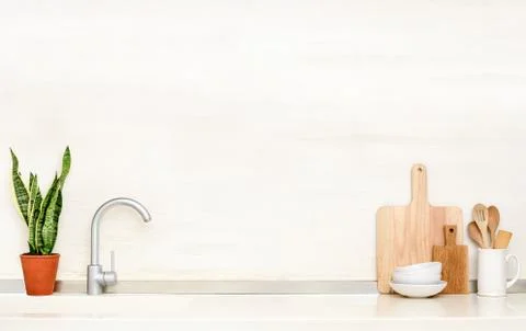 Kitchen table top with sink and utensils Stock Photos