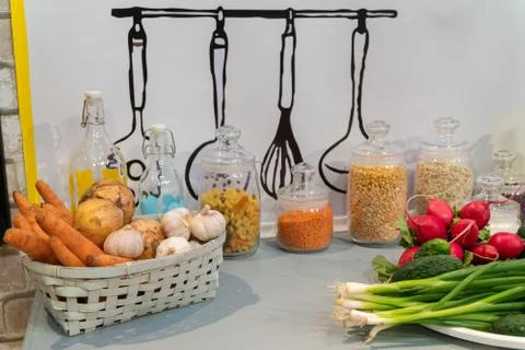 Kitchen table with vegetables in a basket. Beautiful background. Foto stock