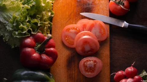 Kitchen table with vegetables. Stock Photos
