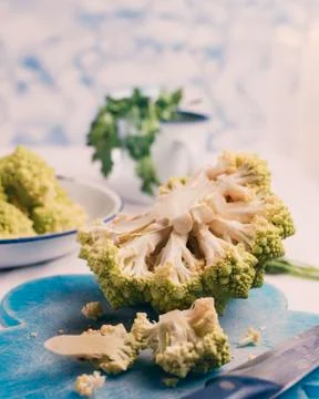 Kitchen table where they are preparing broccoli of the romanescu variety. Stock Photos