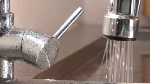 Kitchen tap being turned on 4K Видео 76889248