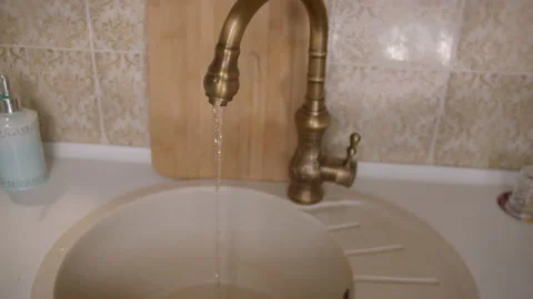 Kitchen tap from which pure running water flows Stock Footage 154720323