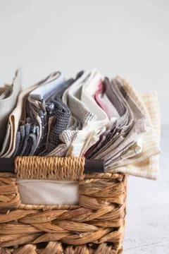 Kitchen textile. stack of fabrics in different colors and textures, close-up. Stock Photos