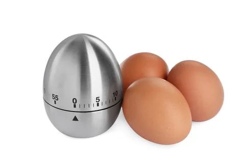 Kitchen timer and chicken eggs on white background Stock Photos