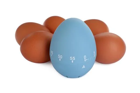 Kitchen timer and chicken eggs on white background Foto stock