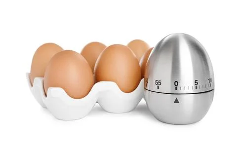 Kitchen timer and chicken eggs on white background Stock Photos