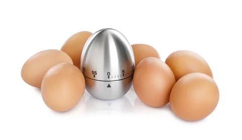 Kitchen timer and chicken eggs on white background Foto stock