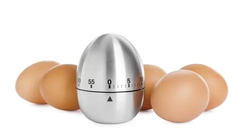 Kitchen timer and chicken eggs on white background Stock-Fotos