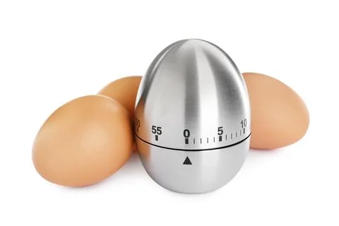 Kitchen timer and chicken eggs on white background Foto stock