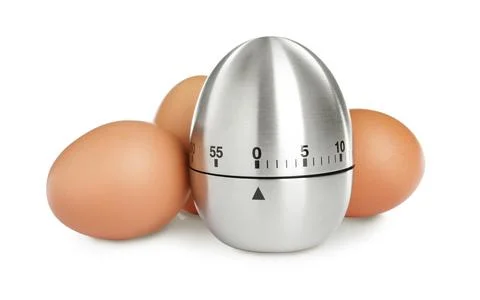 Kitchen timer and chicken eggs on white background Stock Photos