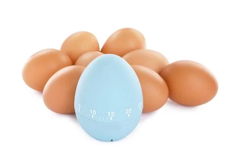 Kitchen timer and chicken eggs on white background Stock Photos