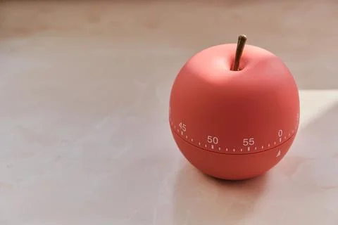 Kitchen timer shaped like a apple on kitchen Stock Photos