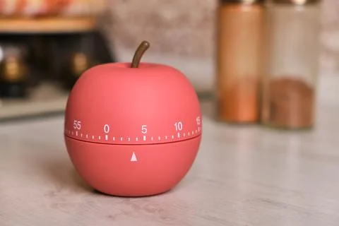 Kitchen timer shaped like a apple on kitchen Stock Photos