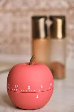 Kitchen timer shaped like a apple on kitchen Stock Photos