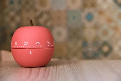 Kitchen timer shaped like a apple on kitchen Stock Photos