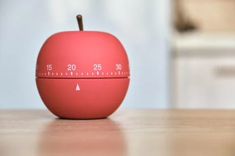 Kitchen timer shaped like a apple on kitchen Stock Photos