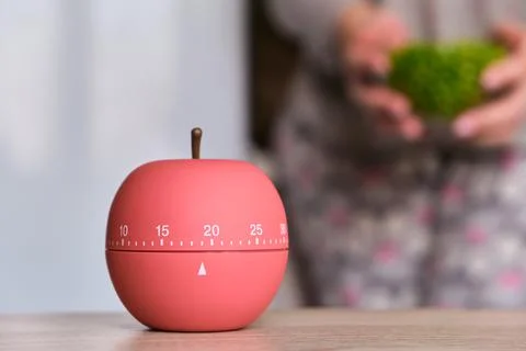 Kitchen timer shaped like a apple on kitchen Stock Photos