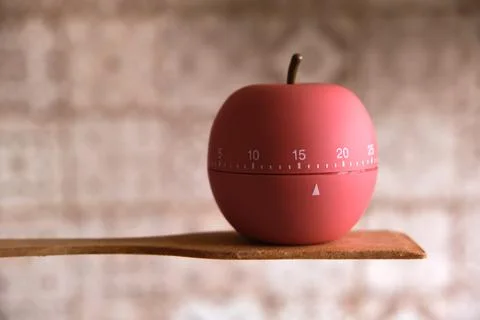 Kitchen timer shaped like a apple on kitchen Stock Photos